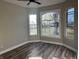 Bright bedroom with hardwood floors and a large bay window at 503 E Clyde St, Frankton, IN 46044