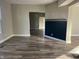 Spacious living room with wood-look flooring and a stylish accent wall at 503 E Clyde St, Frankton, IN 46044
