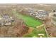 Luxury homes surrounding a golf course in a wooded area at 10771 Holliday Farms Blvd, Zionsville, IN 46077