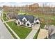 Luxury home with a modern design and a large yard at 10771 Holliday Farms Blvd, Zionsville, IN 46077
