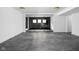 Spacious basement with polished concrete floors and glass doors at 10771 Holliday Farms Blvd, Zionsville, IN 46077