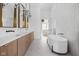 Spa-like bathroom with a freestanding tub, double vanity, and marble countertops at 10771 Holliday Farms Blvd, Zionsville, IN 46077