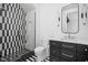 Bathroom with black and white checkered shower, modern vanity at 10771 Holliday Farms Blvd, Zionsville, IN 46077