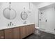 Contemporary bathroom featuring a walk-in shower and double vanity at 10771 Holliday Farms Blvd, Zionsville, IN 46077