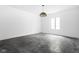Bright bonus room with large window and polished concrete floor at 10771 Holliday Farms Blvd, Zionsville, IN 46077