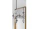 Modern white and black chandelier with gold mirror at 10771 Holliday Farms Blvd, Zionsville, IN 46077