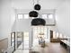 Two-story dining room with large windows and stylish chandelier at 10771 Holliday Farms Blvd, Zionsville, IN 46077