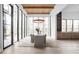 Bright dining area with large windows, wood ceiling, and modern chandelier at 10771 Holliday Farms Blvd, Zionsville, IN 46077