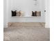 Entryway with built-in bench, rug, and patterned tile floor at 10771 Holliday Farms Blvd, Zionsville, IN 46077