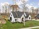 Modern farmhouse style home with white brick and a large backyard at 10771 Holliday Farms Blvd, Zionsville, IN 46077