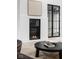Modern fireplace with built-in shelving and a sleek design at 10771 Holliday Farms Blvd, Zionsville, IN 46077