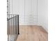 Light and bright hallway with built-in storage and hardwood floors at 10771 Holliday Farms Blvd, Zionsville, IN 46077