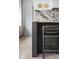 Modern kitchen island with dark stained wood and marble countertop at 10771 Holliday Farms Blvd, Zionsville, IN 46077