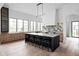 Spacious kitchen boasts a large island, marble countertops, and abundant natural light at 10771 Holliday Farms Blvd, Zionsville, IN 46077