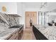 Modern kitchen with marble countertops and island at 10771 Holliday Farms Blvd, Zionsville, IN 46077