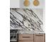 Modern kitchen with marble backsplash and light oak cabinets at 10771 Holliday Farms Blvd, Zionsville, IN 46077
