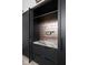 Kitchen pantry with rose gold tile backsplash and marble countertop at 10771 Holliday Farms Blvd, Zionsville, IN 46077