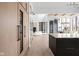 Open kitchen with marble island and wine storage at 10771 Holliday Farms Blvd, Zionsville, IN 46077