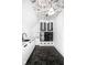 Laundry room with hexagon tile floor, white cabinets, and patterned ceiling at 10771 Holliday Farms Blvd, Zionsville, IN 46077