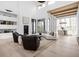 Open-concept living room with high ceilings and large windows at 10771 Holliday Farms Blvd, Zionsville, IN 46077