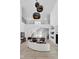 Two-story living room with curved sofa, fireplace, and high ceilings at 10771 Holliday Farms Blvd, Zionsville, IN 46077