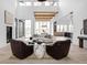 Bright living area featuring a curved sofa and natural light at 10771 Holliday Farms Blvd, Zionsville, IN 46077