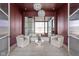 Cozy sitting room with a maroon accent wall and comfortable seating at 10771 Holliday Farms Blvd, Zionsville, IN 46077