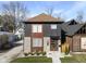 Modern two-story home with gray and wood siding, landscaping, and a walkway at 1514 E 12Th St, Indianapolis, IN 46201