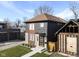 Modern two-story home with gray and wood siding, landscaping, and a walkway at 1514 E 12Th St, Indianapolis, IN 46201