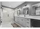 Modern bathroom with double vanity, large shower, and marble flooring at 1514 E 12Th St, Indianapolis, IN 46201