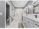 Elegant bathroom featuring a double vanity, a large shower, and a toilet at 1514 E 12Th St, Indianapolis, IN 46201