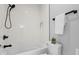 Clean bathroom with a shower/tub combo, toilet and white tile at 1514 E 12Th St, Indianapolis, IN 46201