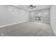 Bright bedroom featuring carpet, a ceiling fan, and access to a deck at 1514 E 12Th St, Indianapolis, IN 46201