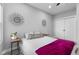 Charming bedroom with queen bed, gray walls, and a window with natural light at 1514 E 12Th St, Indianapolis, IN 46201