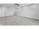 Spacious bedroom with carpeted floor, ceiling fan, and multiple windows at 1514 E 12Th St, Indianapolis, IN 46201