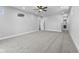 Large bedroom with grey walls, carpet, and access to another room at 1514 E 12Th St, Indianapolis, IN 46201