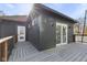 Contemporary deck with gray wood planks and access to a back door and sliding glass door at 1514 E 12Th St, Indianapolis, IN 46201