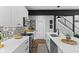 Modern kitchen with white cabinets, patterned backsplash, and stainless steel appliances at 1514 E 12Th St, Indianapolis, IN 46201