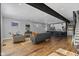 Open living area with hardwood floors, modern furniture, and an open kitchen at 1514 E 12Th St, Indianapolis, IN 46201
