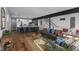 Open concept living room and kitchen with hardwood floors and modern furnishings at 1514 E 12Th St, Indianapolis, IN 46201