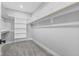 Ample walk-in closet with built-in shelves and hanging rods at 1514 E 12Th St, Indianapolis, IN 46201