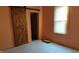 Bedroom with barn door and window at 1607 Draper St, Indianapolis, IN 46203