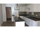 Bright kitchen features white cabinets, an island, and stylish backsplash at 1607 Draper St, Indianapolis, IN 46203