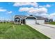 New construction home with two-car garage and landscaped lawn at 161 Maxim Ct, Cumberland, IN 46229