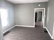 Gray-walled dining room featuring gray flooring and a view into another room at 2103 Arrow Ave, Anderson, IN 46016
