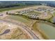 Aerial view of new homes, ponds, and landscaping in a new development at 259 Lar Lan Dr, Danville, IN 46122