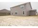 Spacious backyard with patio, grassy area, and neighboring house at 259 Lar Lan Dr, Danville, IN 46122