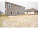 Large backyard with patio and neighboring houses at 259 Lar Lan Dr, Danville, IN 46122