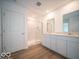 Modern bathroom with double vanity, shower, and light flooring at 259 Lar Lan Dr, Danville, IN 46122