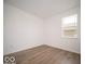 Simple bedroom with hardwood floors and a large window at 259 Lar Lan Dr, Danville, IN 46122